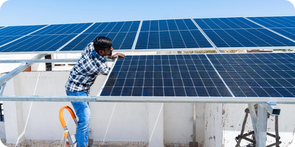 Solar technician maintaining panels